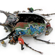Image for article titled Cyborg taxidermy transforms beetles into airplanes and buses